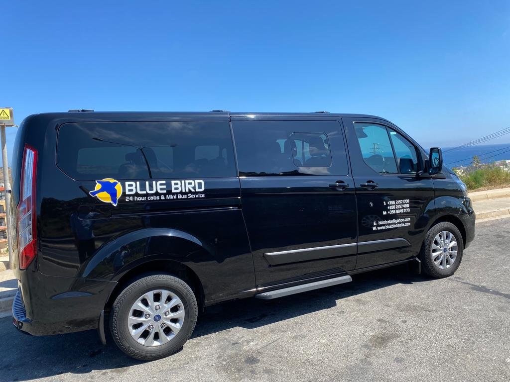 Blue Bird liveried people carrier